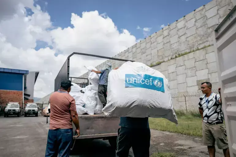 UNICEF staff load pre-positioned hygiene kits at Tribhuvan International Airport in Kathmandu