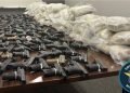 Michigan semi stop uncovers 368 pounds of suspected heroin and 174 handguns
