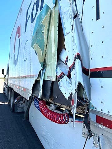 Arizona Highway Patrol officer inspecting a commercial truck near Bapchule